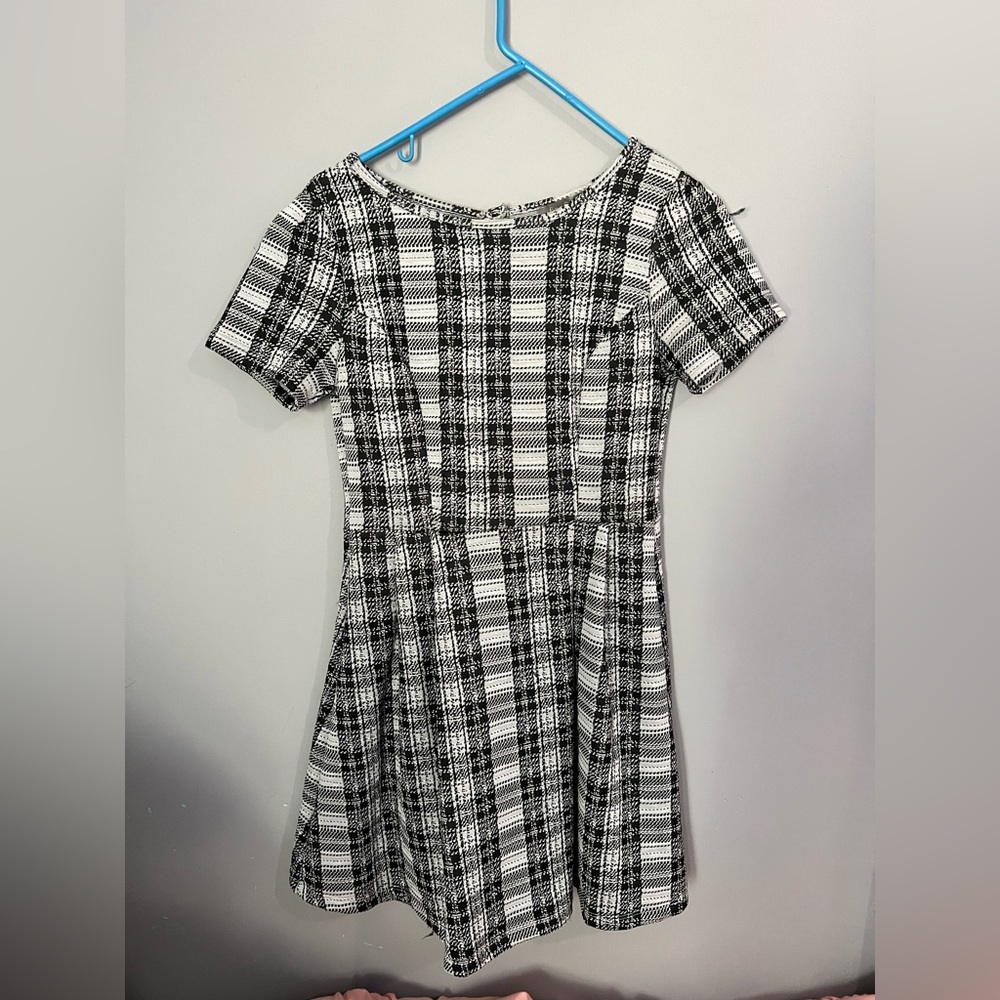 Black & White dress. Cut out back 
Never worn. Very flattering on